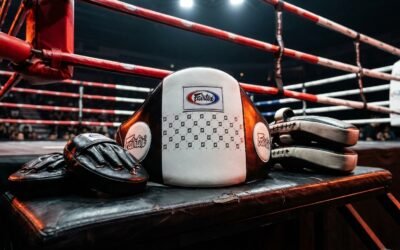StrikeGearHQ realistic product-source feature image for Best Muay Thai Pad Holder Belts for Coaches (2026)